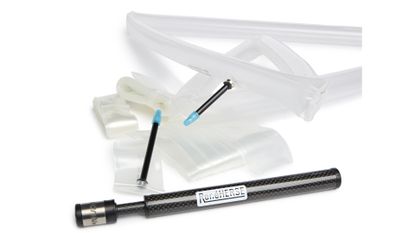 Two clear TPU tubes with black all-metal valves and light blue valve caps with a black Rene Herse Cycles mini pump in the forefront and bottom 1/3 of the frame.