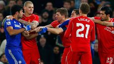 Diego Costa of Chelsea clashes with Liverpool FC players