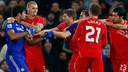 Diego Costa of Chelsea clashes with Liverpool FC players