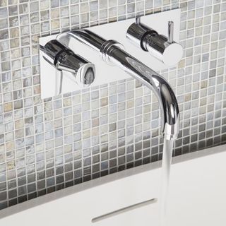 bathroom with mixer tap and mosaic tiles