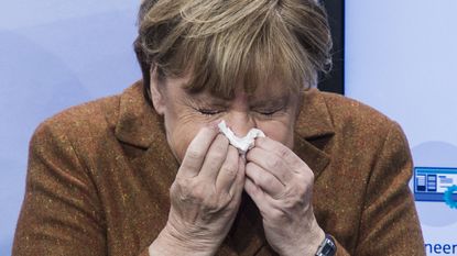 Angela Merkel sneezes 
