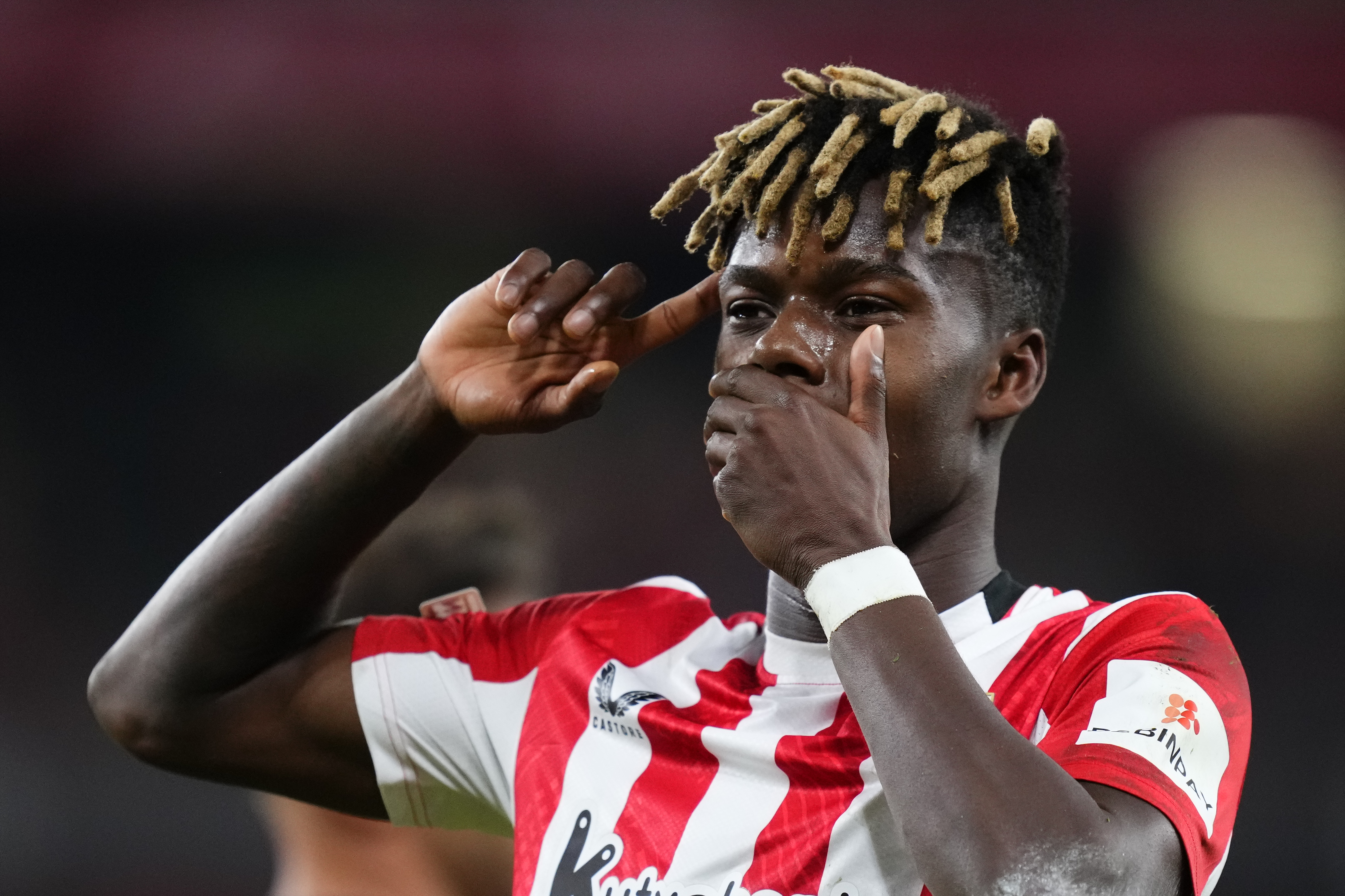 Nico Williams with his hand over his mouth, pointing to his head, after scoring for Athletic against Rangers