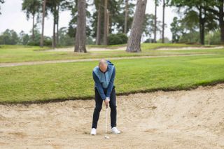 Adam Harnett stood in a bunker with a compact lie