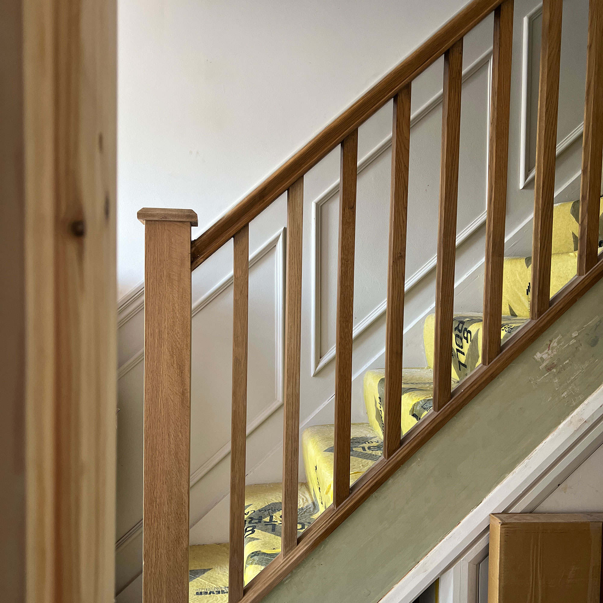Wooden staircase and banisters mid renovation