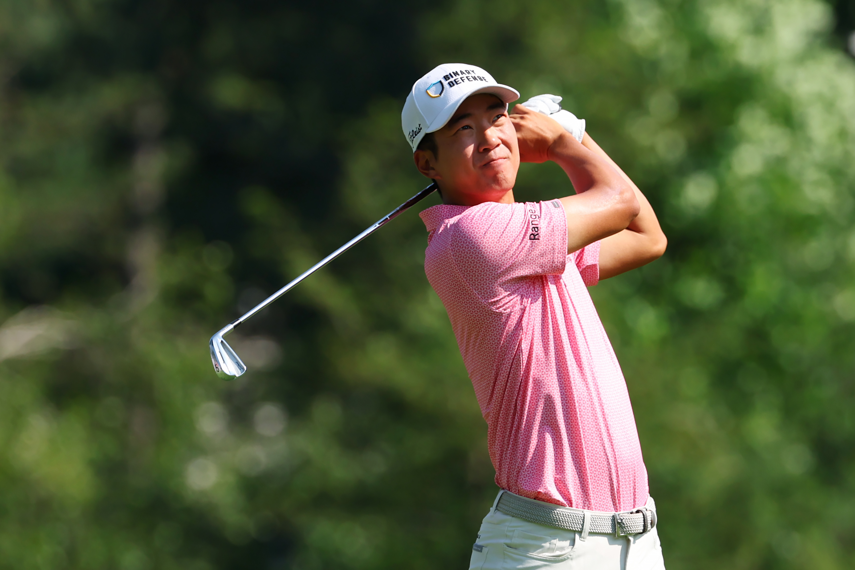 Michael Kim hits an iron shot