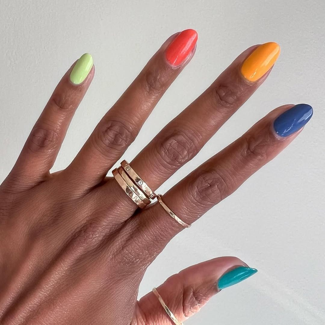 Multiple nail polishes on different fingers.
