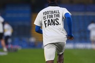 Brighton display a message on their shirts at Stamford Bridge