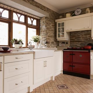 kitchen with granite surfaces and stone floor tiles