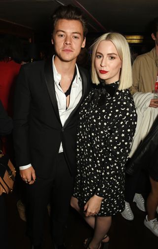 Harry Styles (L) and sister Gemma Styles attend the Another Man A/W launch event hosted by Harry Styles, Alister Mackie and Kris Van Assche at Albert's Club on October 6, 2016 in London, England