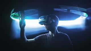 Man in Virtual Reality headset with hand extended out in front of him