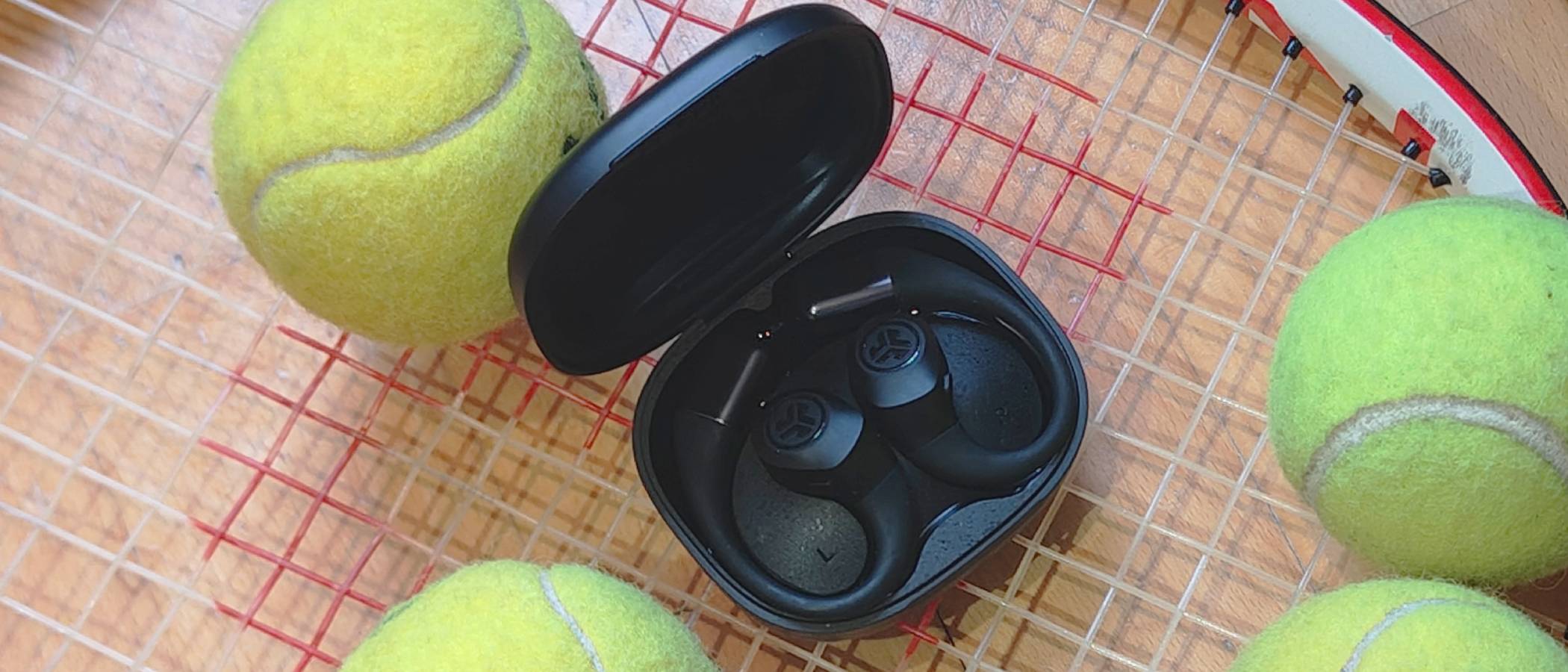 The JLab Epic Open Sport on a tennis racquet.