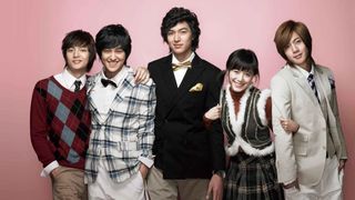 five teenagers in preppy clothing pose in front of a pink backdrop, in the korean drama 'boys over flowers'