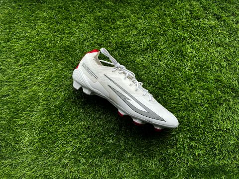 Sokito Scudetta football boots reviewed. The boots are placed on a piece of turf ahead of being reviewed. 