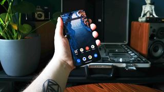 Hand holding Asus ROG phone 8 Pro