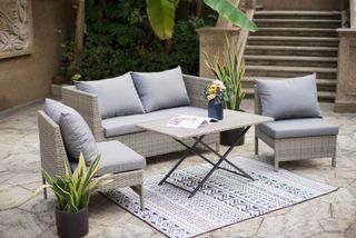 patio sofa with outdoor rug from the range