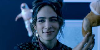 Aurora Perrineau softly smiling in It Takes Three