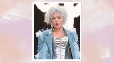 Portrait of Cyndi Lauper during her Glastonbury performance wearing a silver corset, blue blazer and a hot pink lipstick 