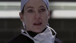 Meredith crying as she removes a bomb from a patient's chest