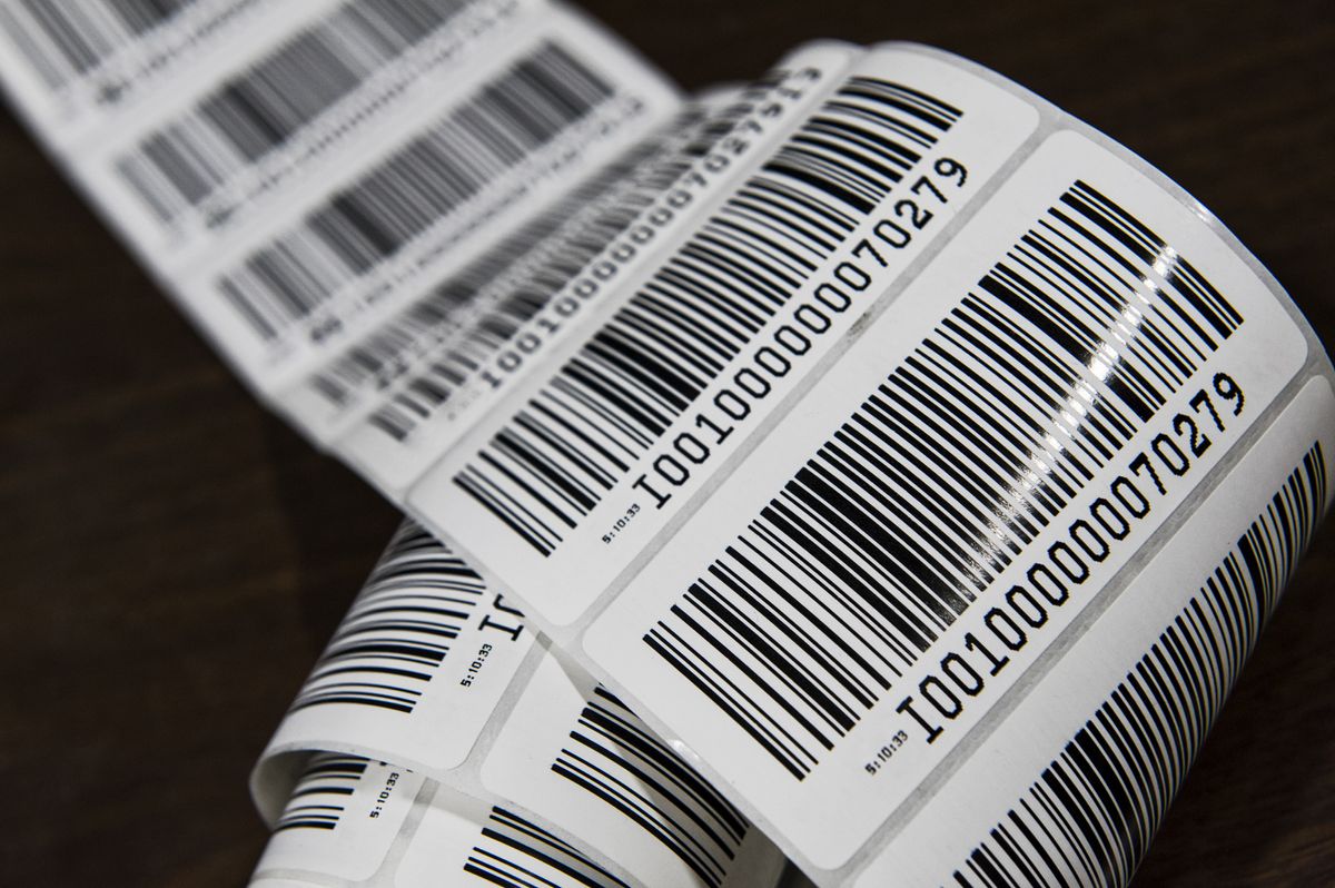 A close up image of a roll of sticker barcodes