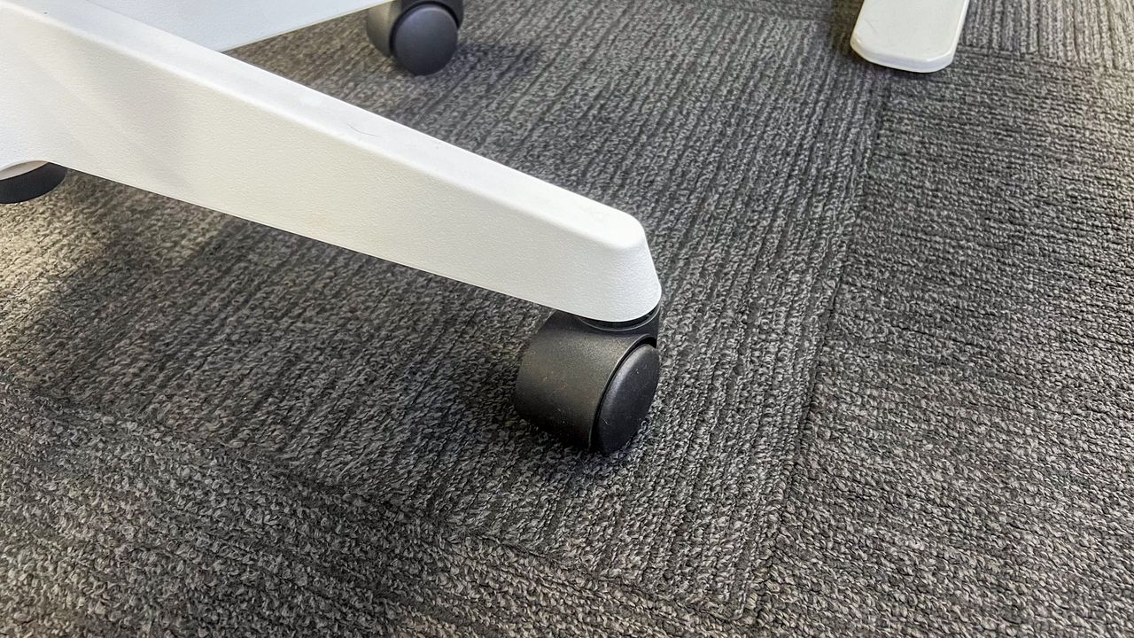 A plastic caster wheel on the Desky Swivel 3D Tilt office chair