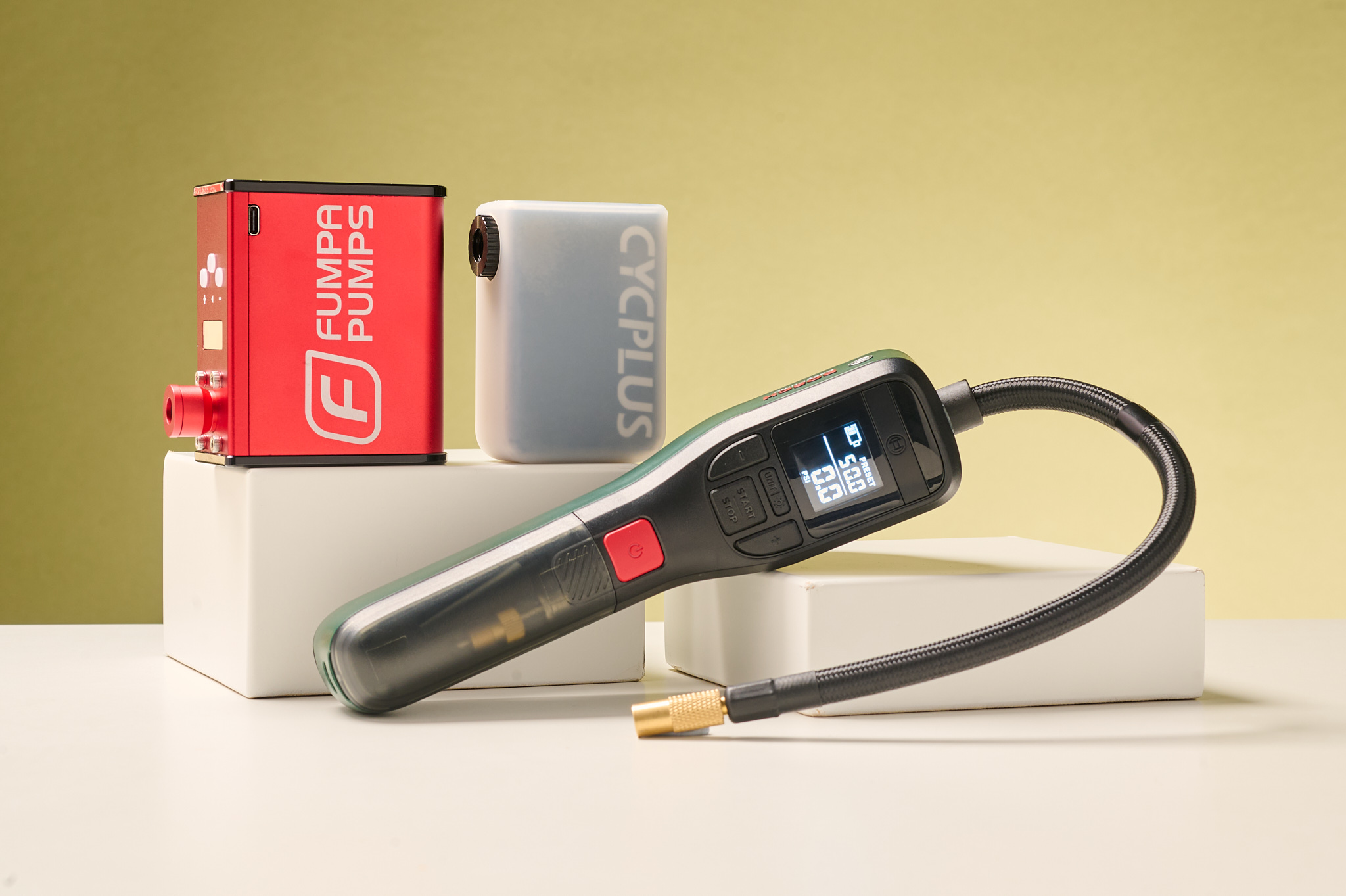 Three of the best electric bike pumps, the 'Off-bike/ workshop' category, featuring Fumba, Cycplus and Bosch.
