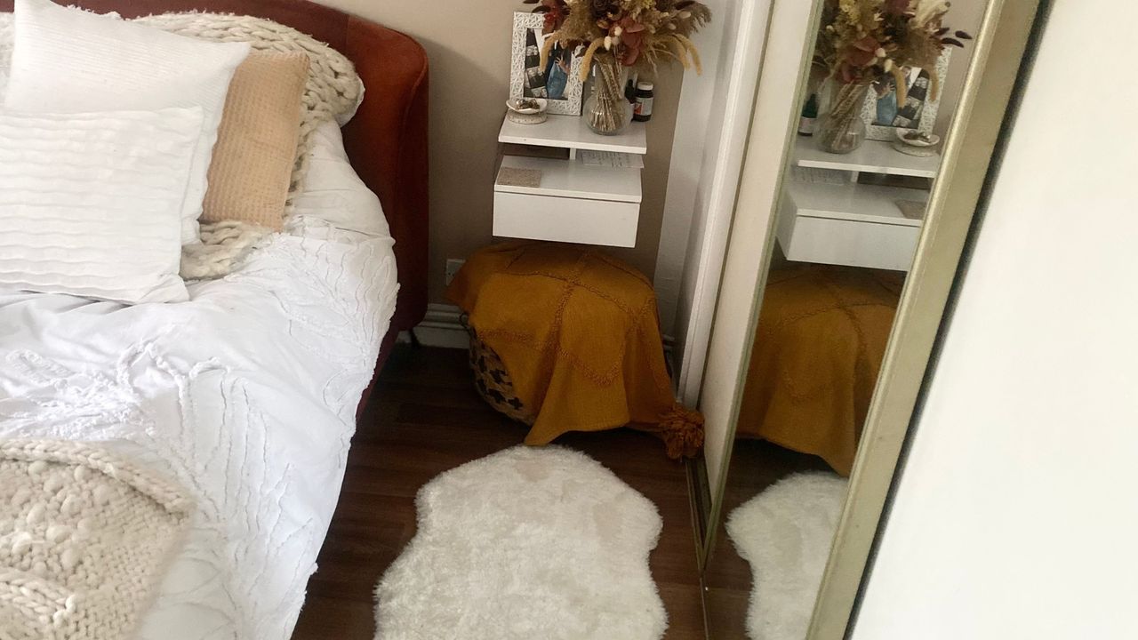 IKEA white faux sheepskin rug beside Annie&#039;s bed in her bedroom