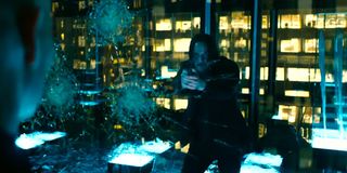 Keanu Reeves holding a gun in John Wick Chapter 3 parabellum