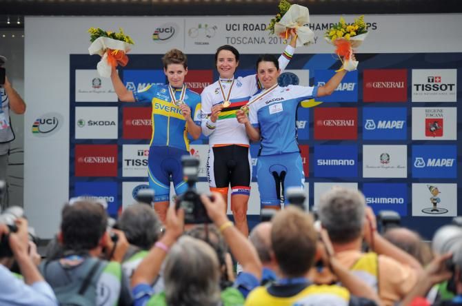 Marianne Vos on the top step of the podium after winning the women's world road race in Italy