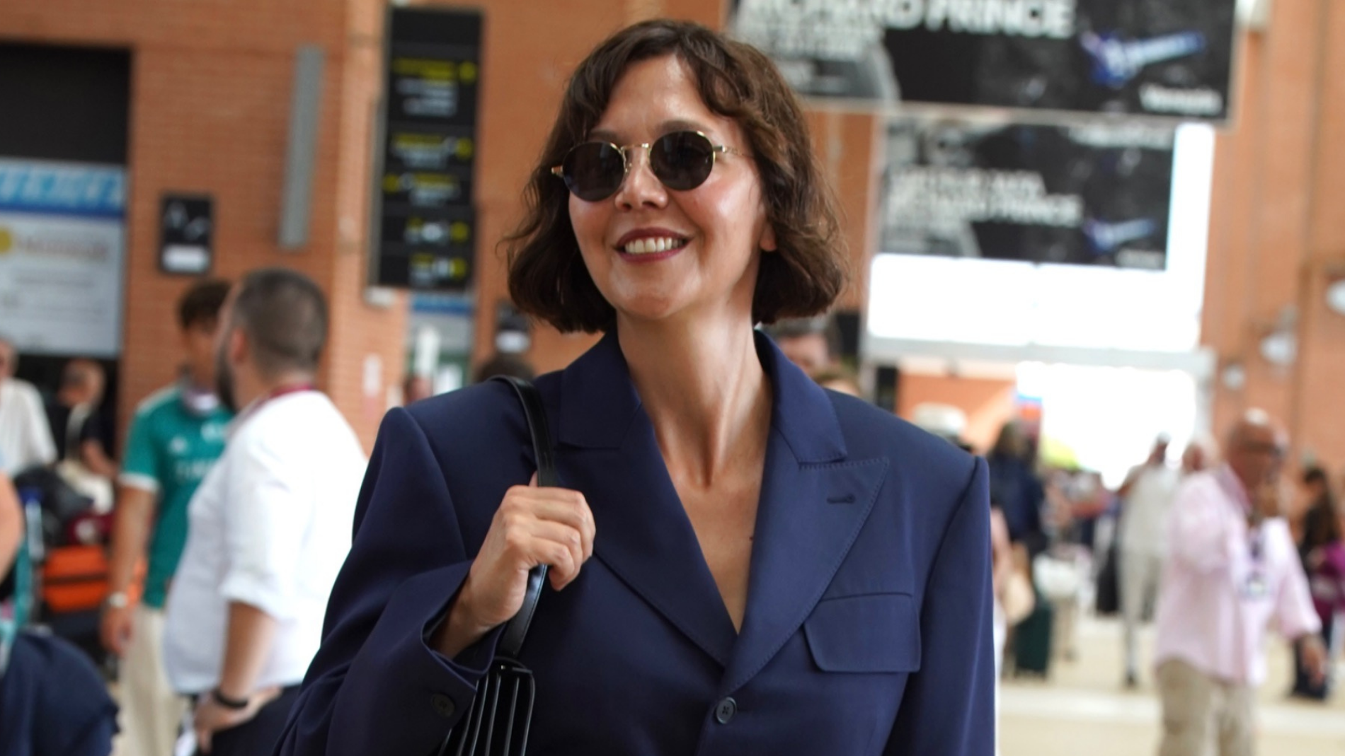 Hold the Blue Jeans—This Elegant Denim Color Makes Any Airport Outfit Look Chic