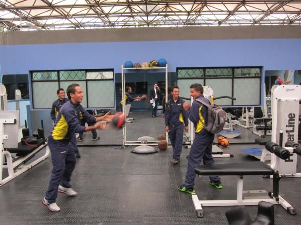 The riders throw around a medicine ball as they prepare for the first day of testing.