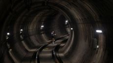 A participant runs through the subway tunnel during a race to commemorate the 100th anniversary of the Barcelona metro, in Barcelona, Spain