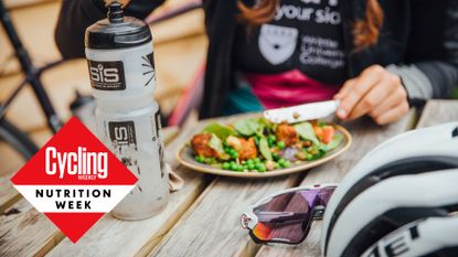 A female cyclist eating a plate of food packed with protein and vegetables to help prevent muscle pain