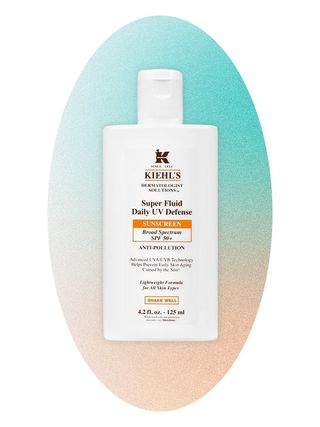 Kiehl's sunscreen on an ombre blue and peach background