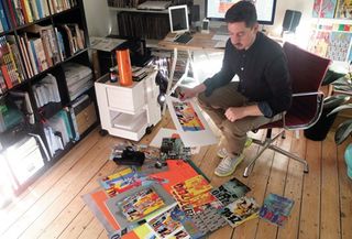 Tom Muller in his studio, where he creates the design concepts for each issue of Zero, a spy comic from writer Ales Kot