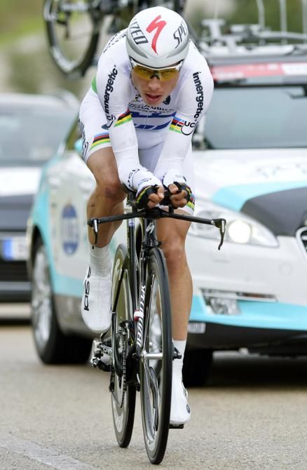 Tony Martin (Omega Pharma-Quick Step) honoured his world champion's kit as he won the final stage time trial by more than one minute.