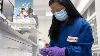 Gilead scientist engaging in research activity in laboratory