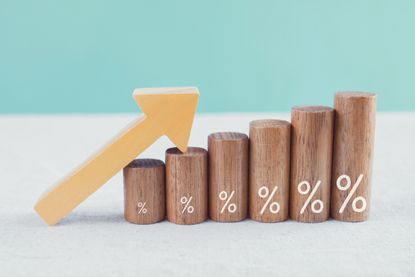 Wooden blocks with percentage sign and arrow up