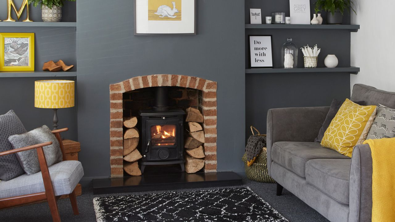 Grey living room with wood burner in exposed brick fireplace