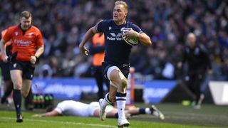 Duhan van der Merwe with the ball and about to score a try for Scotland.