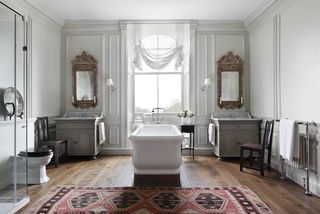 Rustic bathroom with twin sinks and freestanding bath
