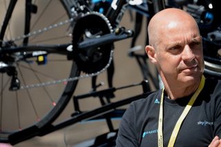 Dave Brailsford with a bike in the background during the 2012 Tour