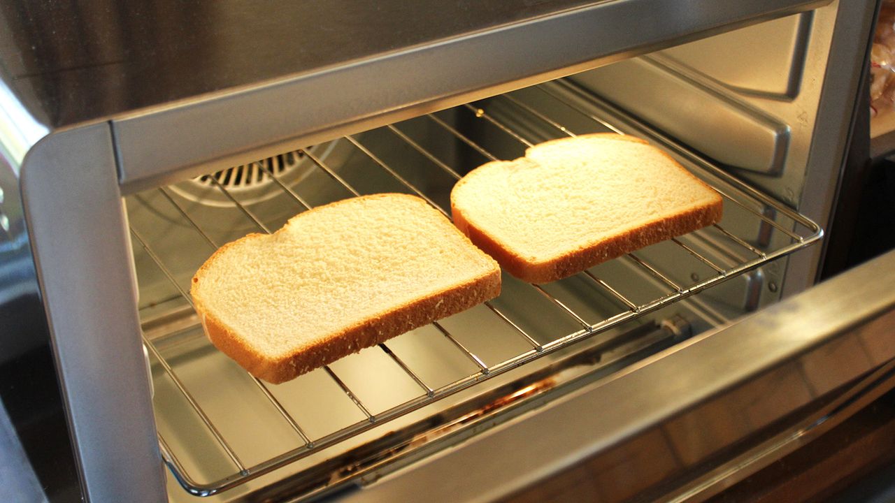Ninja Prestige Smart XL Air Fryer &amp; Countertop Oven being tested in a white kitchen