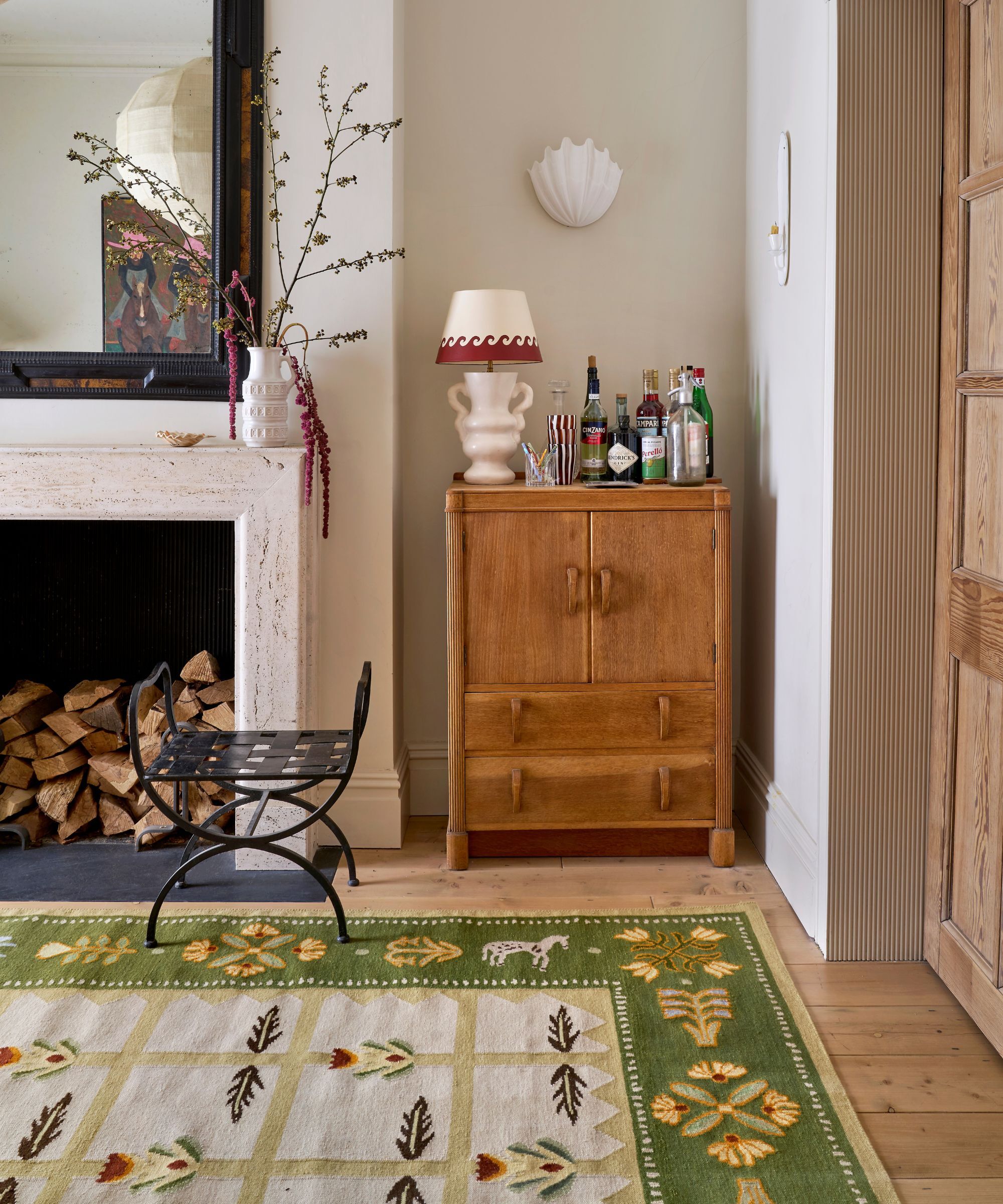 Rustic style sitting room with a green aztec rug