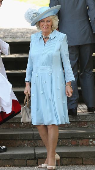 Queen Camilla in an elegant blue dress