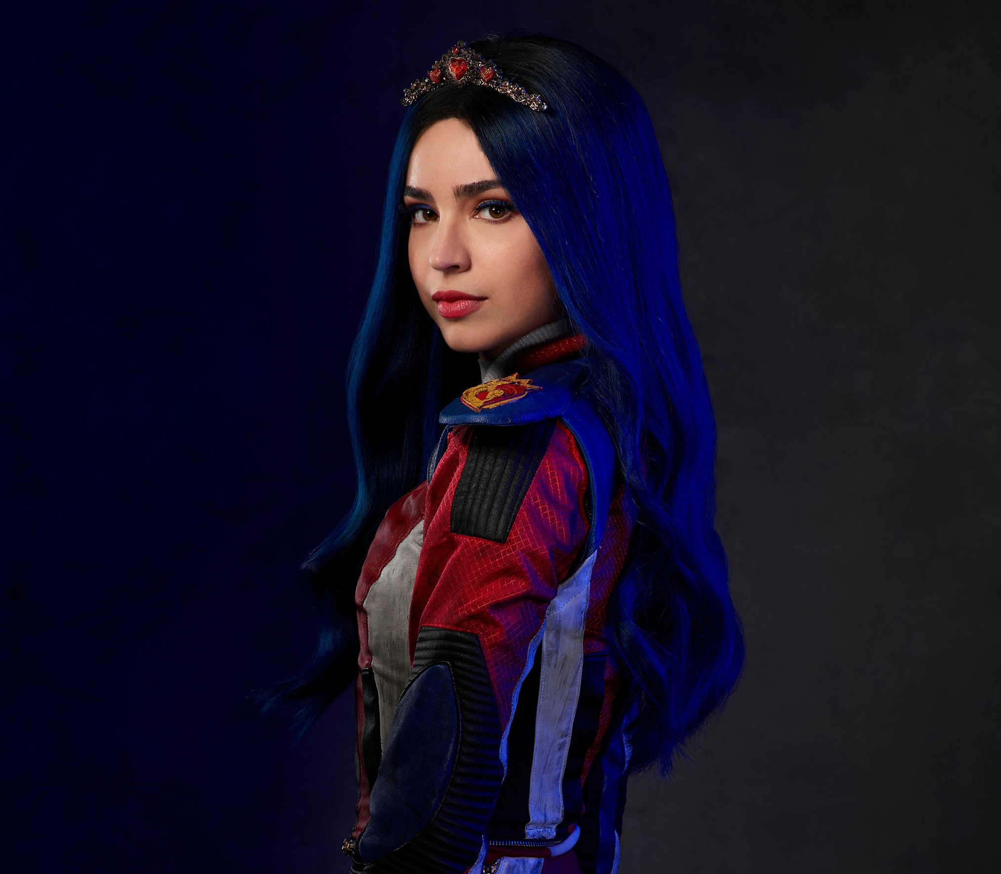 Sofia Carson as Evie