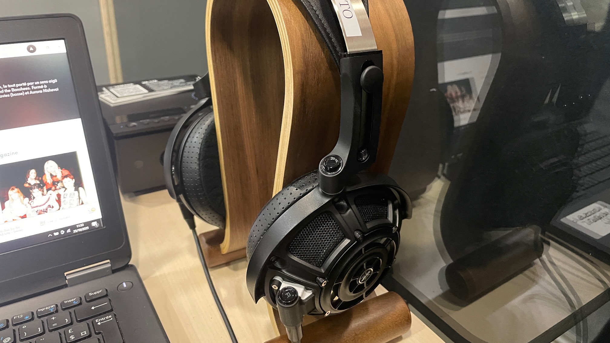 A selection of headphones, including the Audio-Technica ATH-ADX7000 worn by a man in Paris