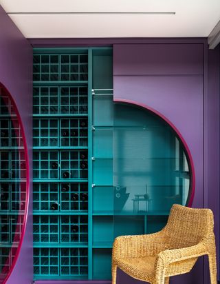 A wine cabinet painted in purple and green hues