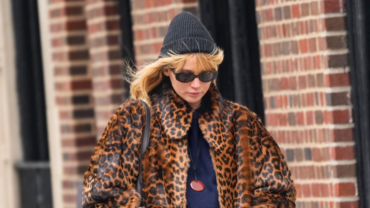 Jennifer Lawrence in a leopard print coat with a beanie and weatherproof boots in New York