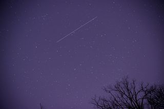 A meteor streaks across the night sky in Nashville, Tennessee, United States as the Geminid meteor shower reached its maximum in the early morning of December 14, 2021.