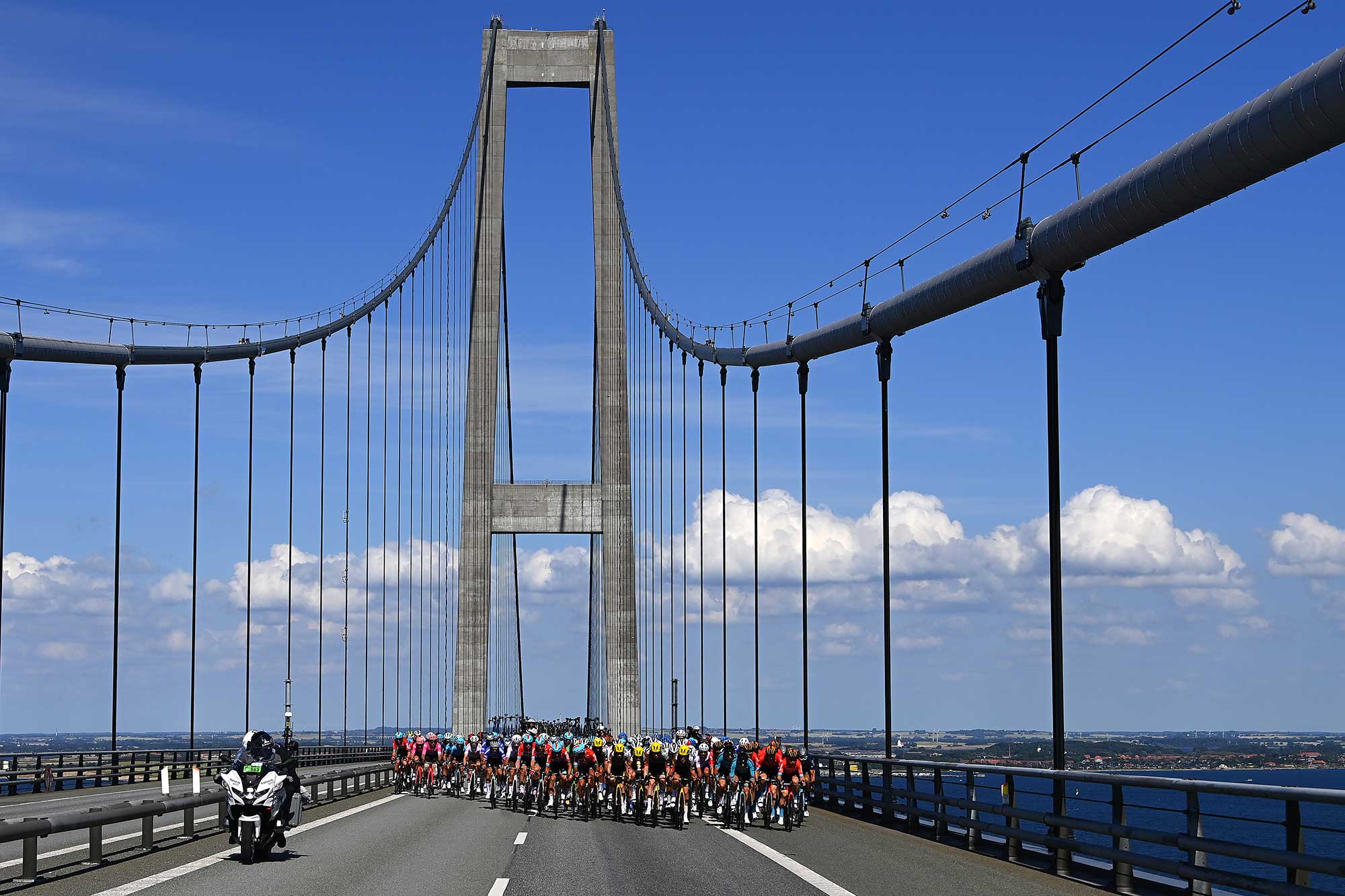 NYBORG DENMARK JULY 02 A general view of the Peloton passing through Gran Belt Bridge during the 109th Tour de France 2022 Stage 2 a 2022km stage from Roskilde to Nyborg TDF2022 WorldTour on July 02 2022 in Nyborg Denmark Photo by Tim de WaeleGetty Images